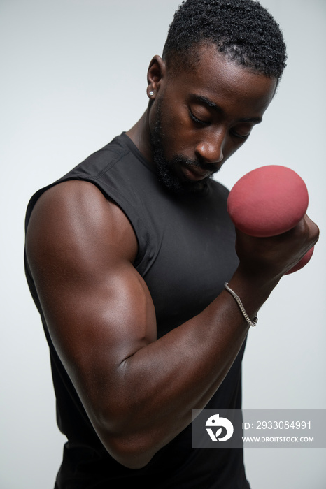 Man training arm with dumbbell