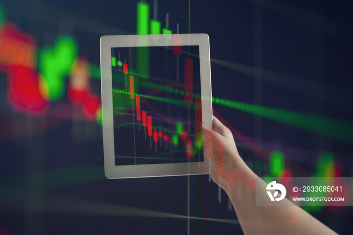 Hands holding tablet showing graphs going down. Double exposure with graphs, digital. Virus alert, coronavirus pandemic, crisis, unemployment. COVID-19 epidemic. Collapse of financial markets.