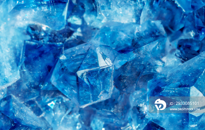 Blue Crystal Mineral Stone. Gems. Mineral crystals in the natural environment. Texture of precious and semiprecious stones. Seamless background with copy space colored shiny surface of precious stones