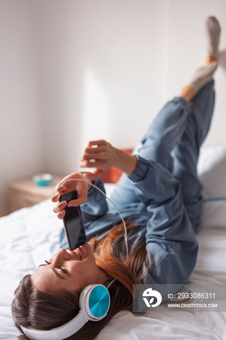 Woman listening to the music and singing