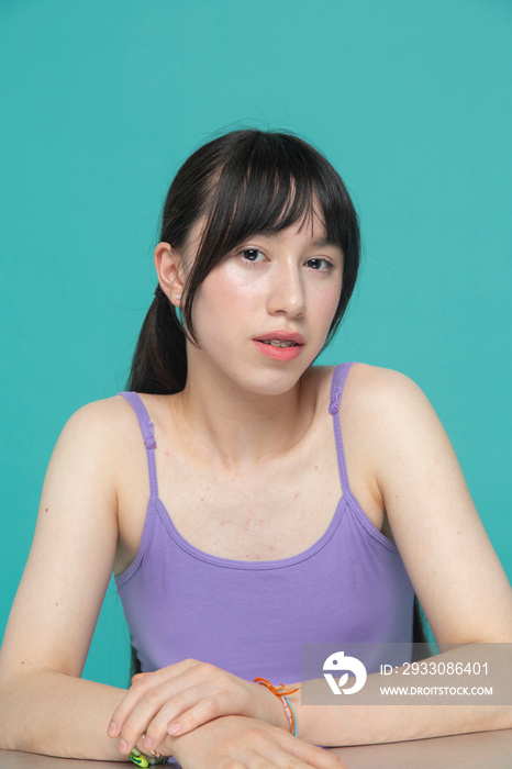 Studio portrait of pensive girl