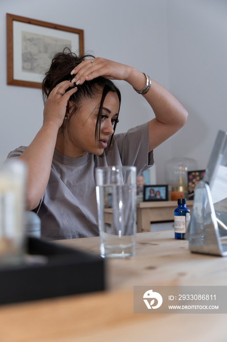 Woman preparing hair at home