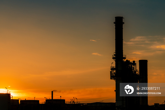 Gas turbine electrical power plant. Energy for support factory in industrial estate. Natural gas tank. Small gas power plant. Power plant using natural gas for fuel. Green energy. Dramatic sunset sky.