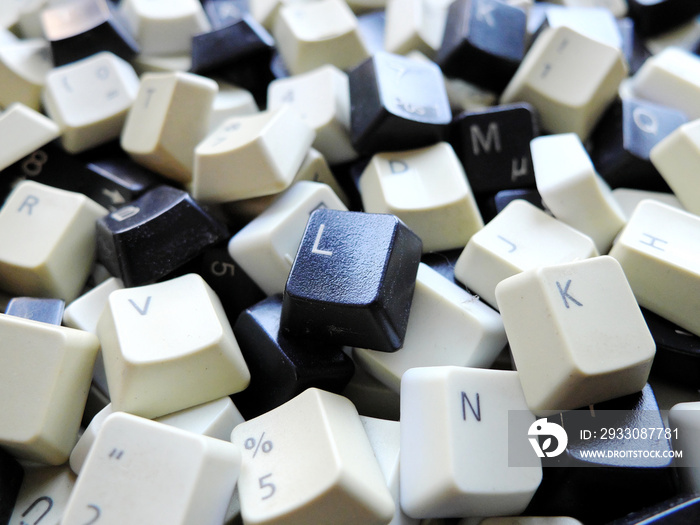 Black and white computer keyboard keys close-up. Concept of unstructured big data that need to be sorted ready to be consumed by machine learning model for deep learning.