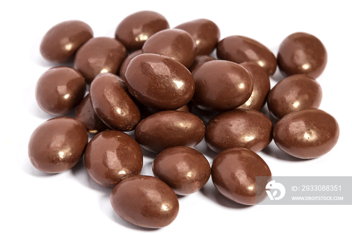 chocolate pills in heap isolated on white background