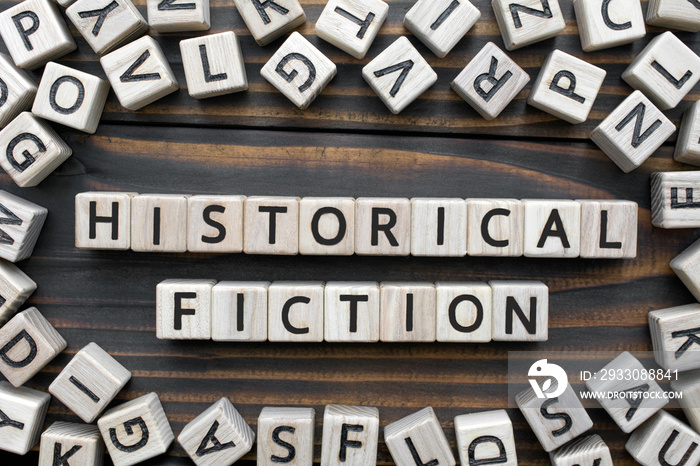 historical fiction - word from wooden blocks with letters, Literary Genres concept, random letters around, top view on wooden background