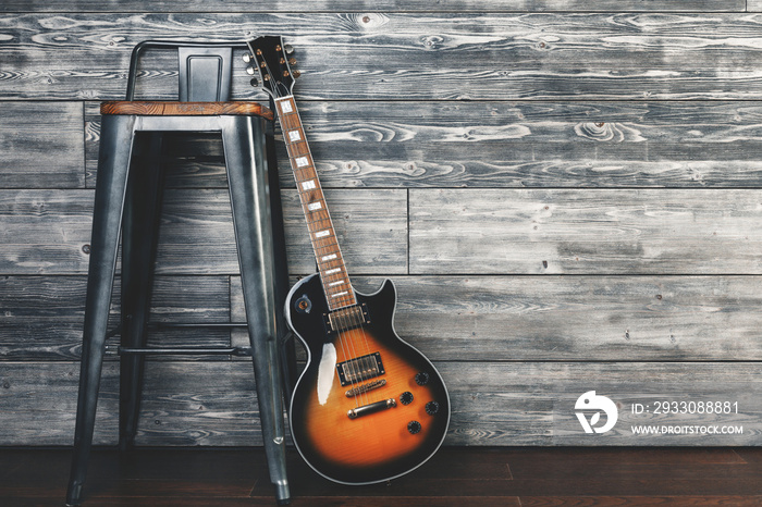 Guitar and chair in studio