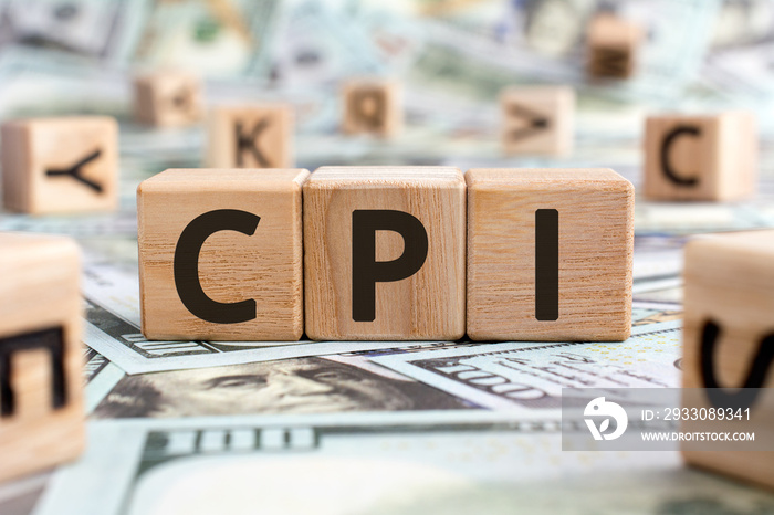 CPI - acronym from wooden blocks with letters, abbreviation CPI Consumer price index concept, random letters around, money background