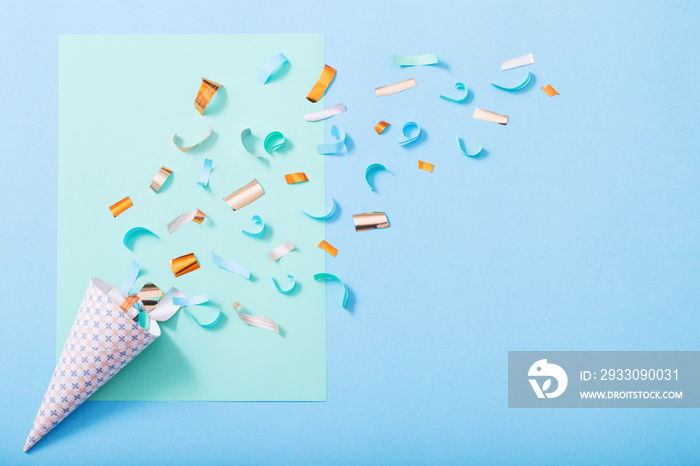 birthday hat with confetti on paper background