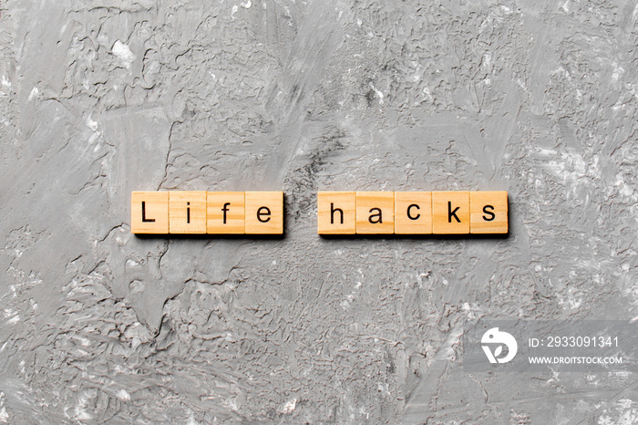 life hacks word written on wood block. life hacks text on table, concept