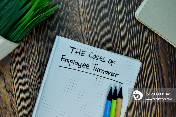 The Costs of Employee Turnover write on a book isolated on Wooden Table.