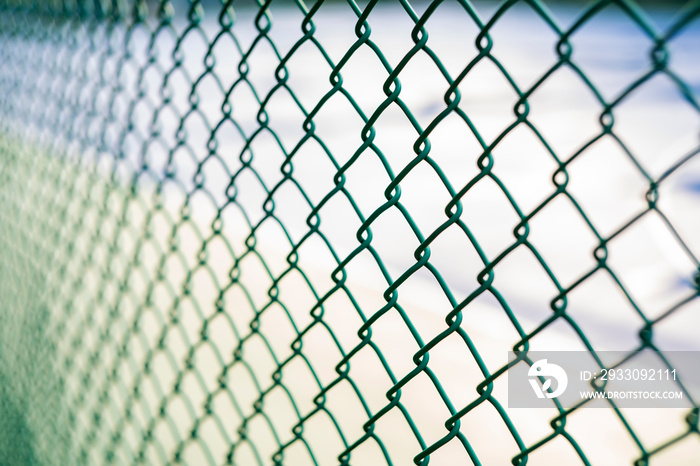 Close-up chain link fence , Sunset background