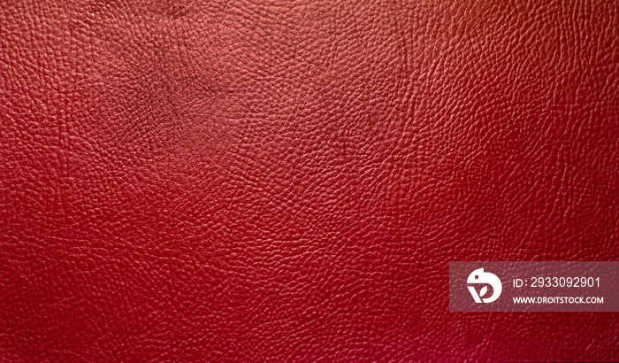 Red leather texture background.Burgundy leather fabric. The texture is red for the text.