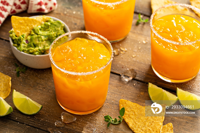 Pineapple and mango margarita with chips and guacamole