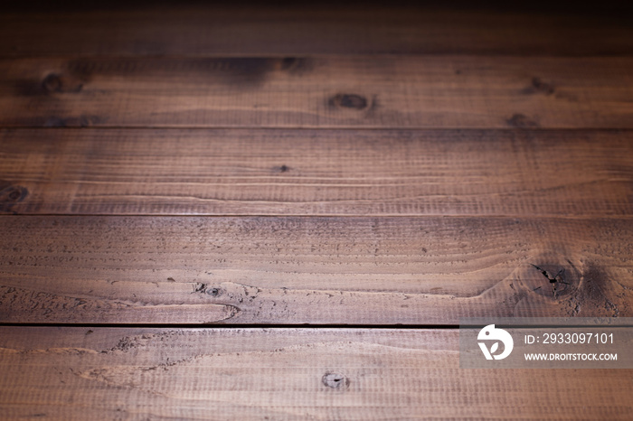 Dark wooden table top background texture.   Wood tabletop closeup as plank board surface