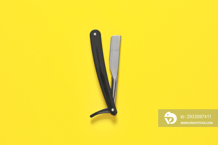 Shaving razor on color background