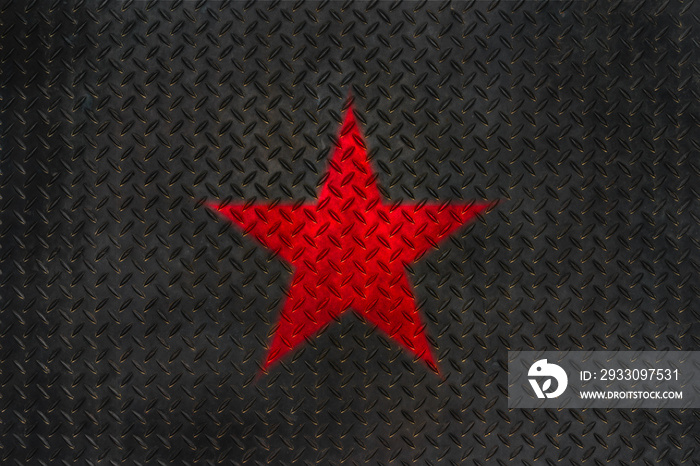 Red star on grunge metal diamond plate floor texture.