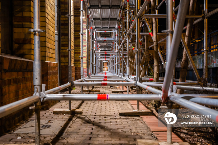 illuminated scaffolding at night, steel, abstract, no workers, nice scaffolding at night