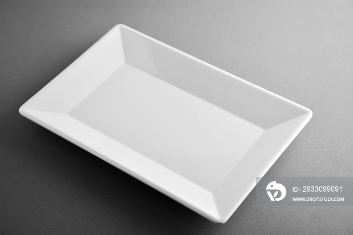 square plate on grey background - light and shadow