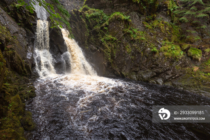 Waterfall at plodda falls in the scottish highlands