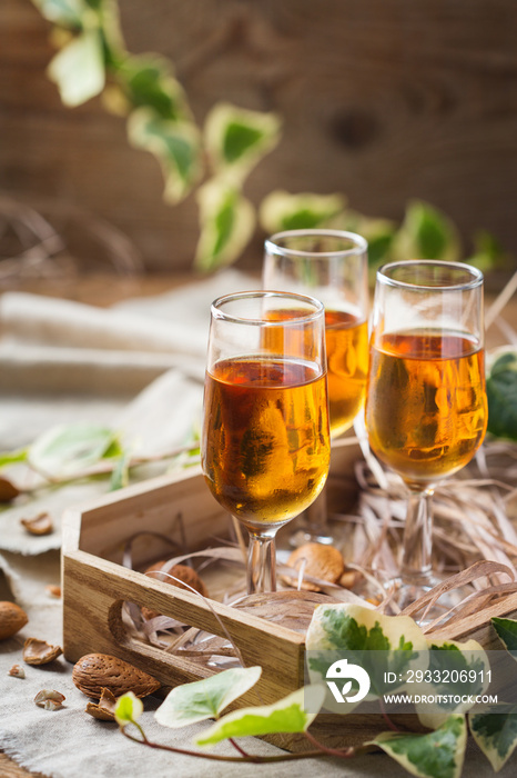 Italian almond liquor amaretto on a wooden table