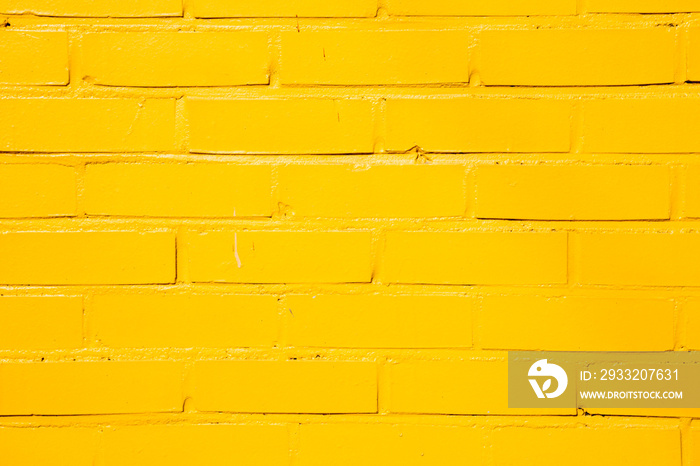 黄色彩绘砖墙背景