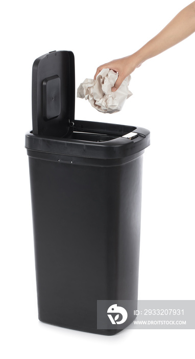 hand throwing paper in modern garbage can isolatedon white background