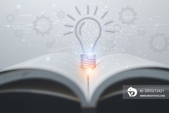 书上发光的灯泡从阅读中获得灵感。创新的想法或知识o