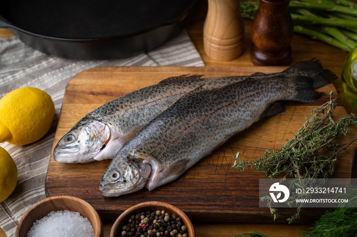 fresh trout on wooden cutting board