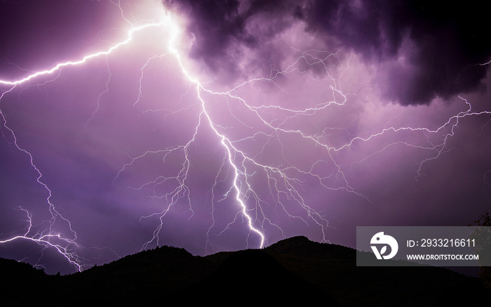 Powerful purple lightning during a thunderstorm