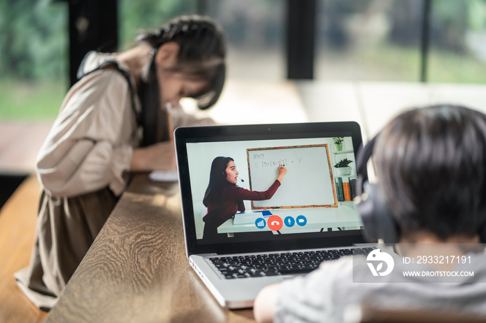 Homeschool Asian little young girl learning online class with teacher