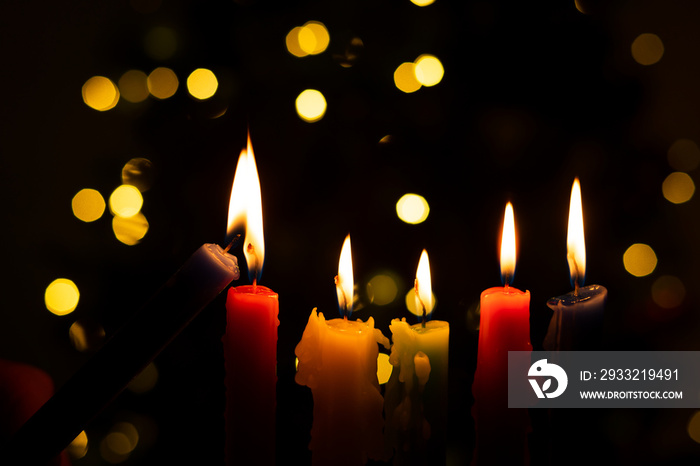 Candlelight Day. Traditional Colombian holiday. Group of candles lit at night with unfocused lights 