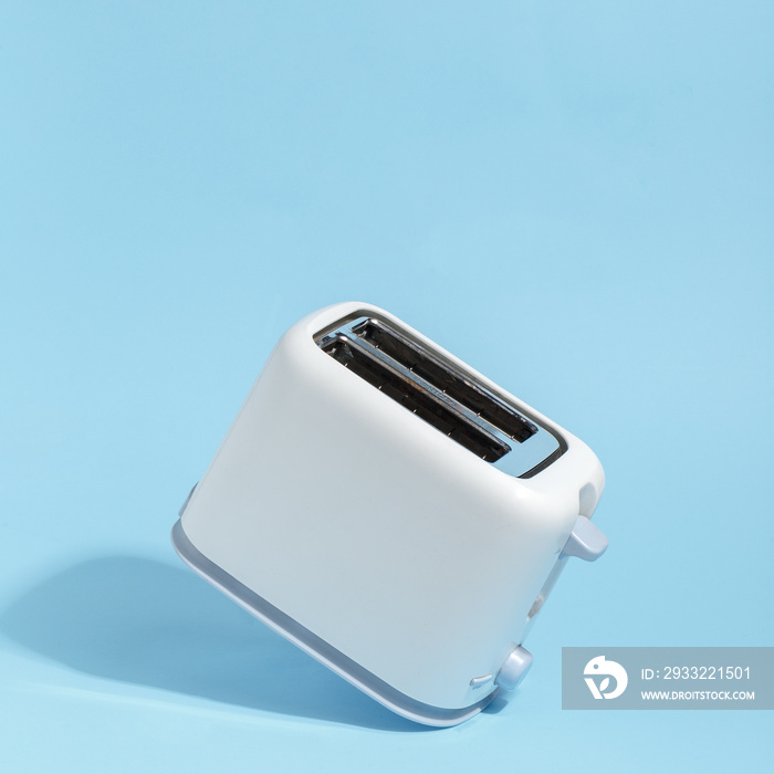 Stylish white toaster in retro style against a blue background