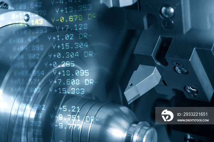 The abstract scene of CNC lathe machine rough cutting the metal shaft parts and the NC data backgrou