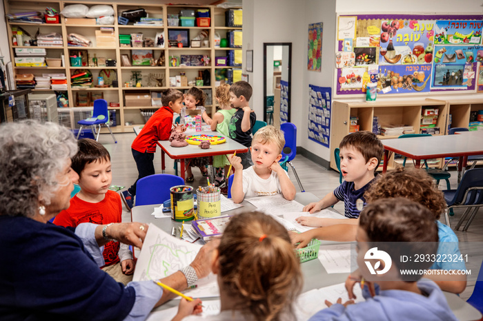 Teacher and children in a classroom