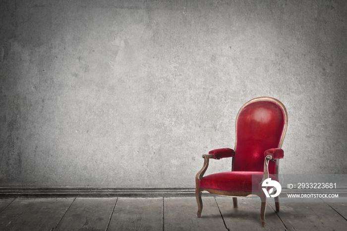 Red chair in an empty room