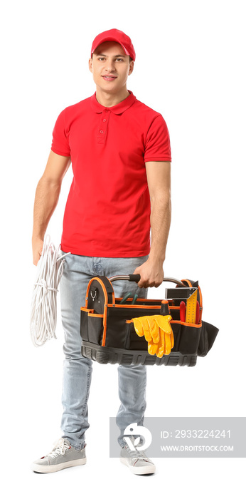 Young electrician with tools on white background