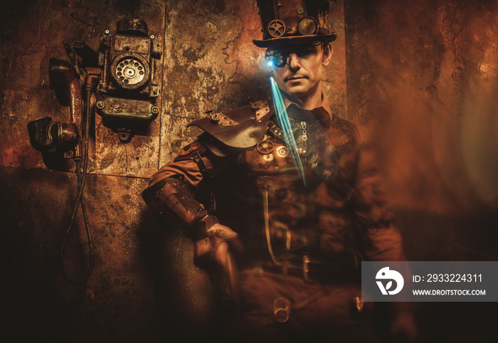 Portrait of steampunk man with various mechanical devices on vintage steampunk background