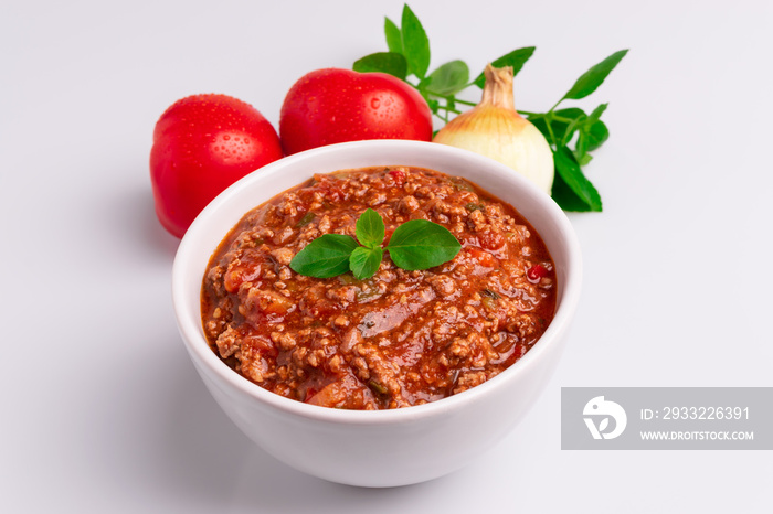 Bolognese (also know as Bolognesa or Bolonhesa) sauce in a white bowl isolated in white background, 