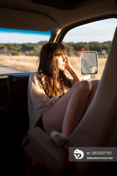 Young woman in car seat