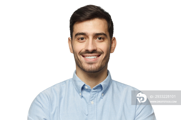 Close-up portrait of positive man in blue shirt, isolated on white background