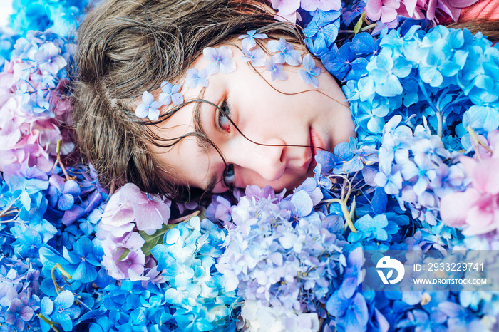 girl with summer makeup. Makeup cosmetics and skincare. Spring woman with hydrangea flowers. Summer 