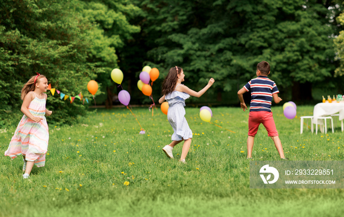 friendship, childhood, leisure and people concept - group of happy kids or friends playing tag game 