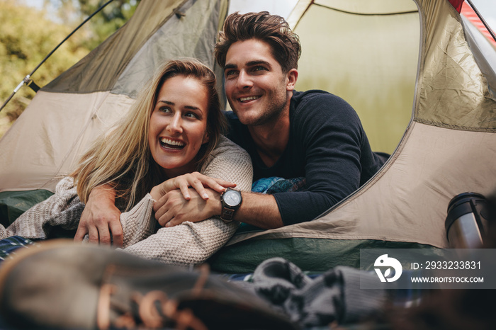 Loving couple relaxing in tent