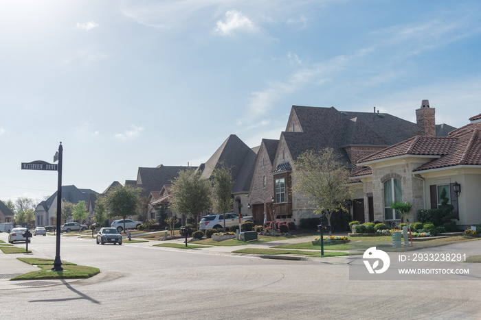 Row of brand new two story houses in upscale residential neighborhood in suburbs Dallas, Texas