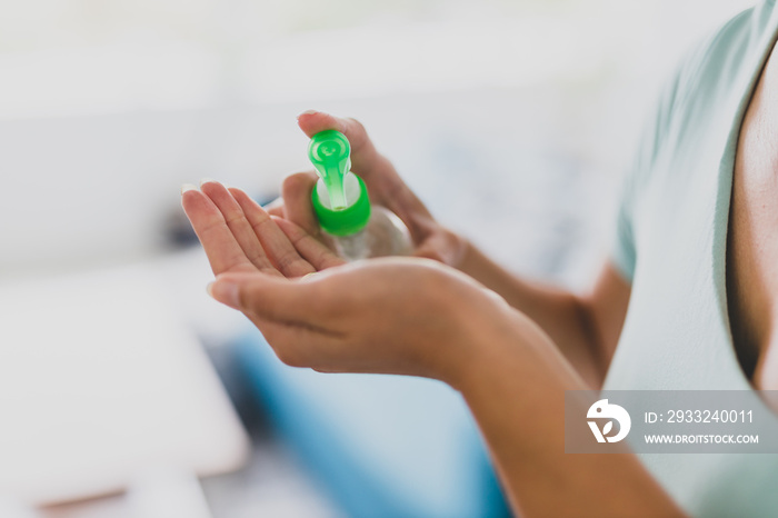 womans hands using sanitizing gel, good personal hygiene to fight bacteria and viruses