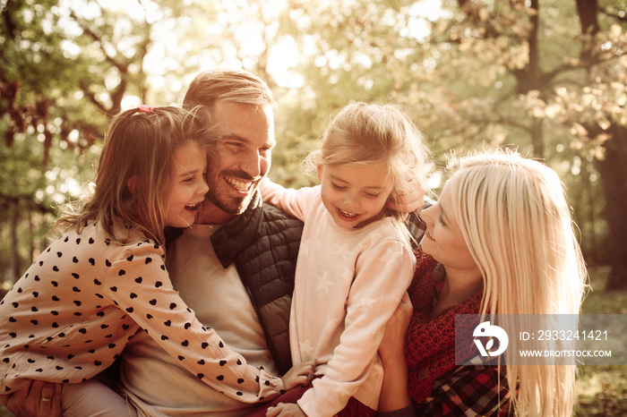 Happy family in park.