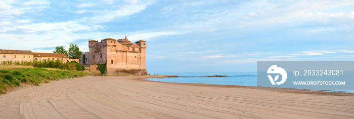 Castle on the beach at sunset panoramic view