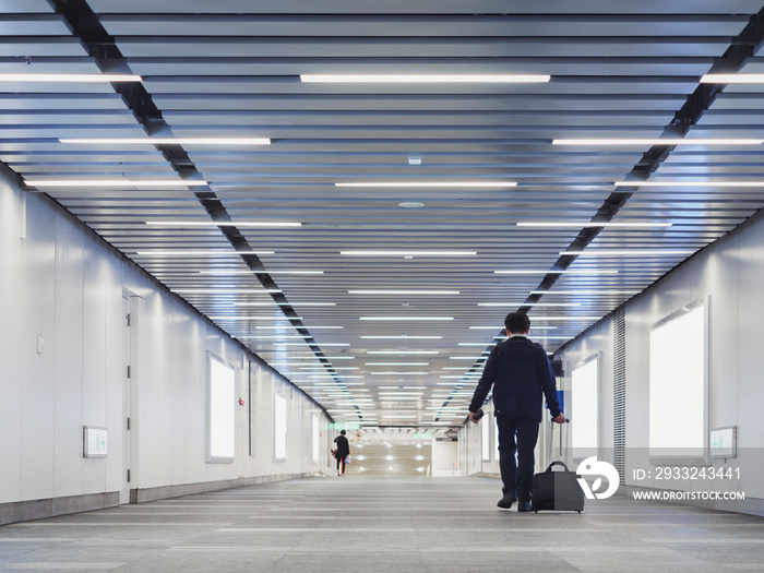 People walking hall indoor airport Asian traveler with luggage