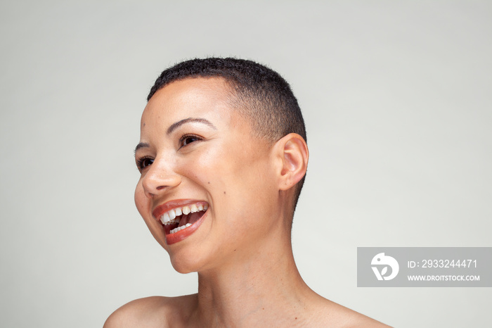 Studio portrait of smiling woman